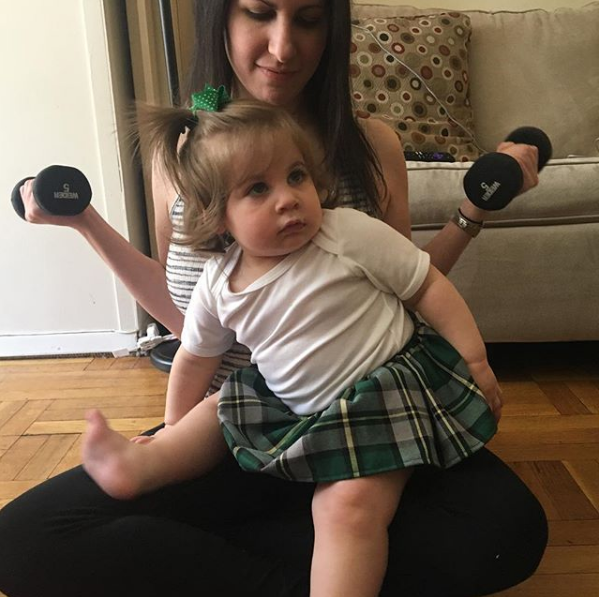 mom lifting with kid on lap in person